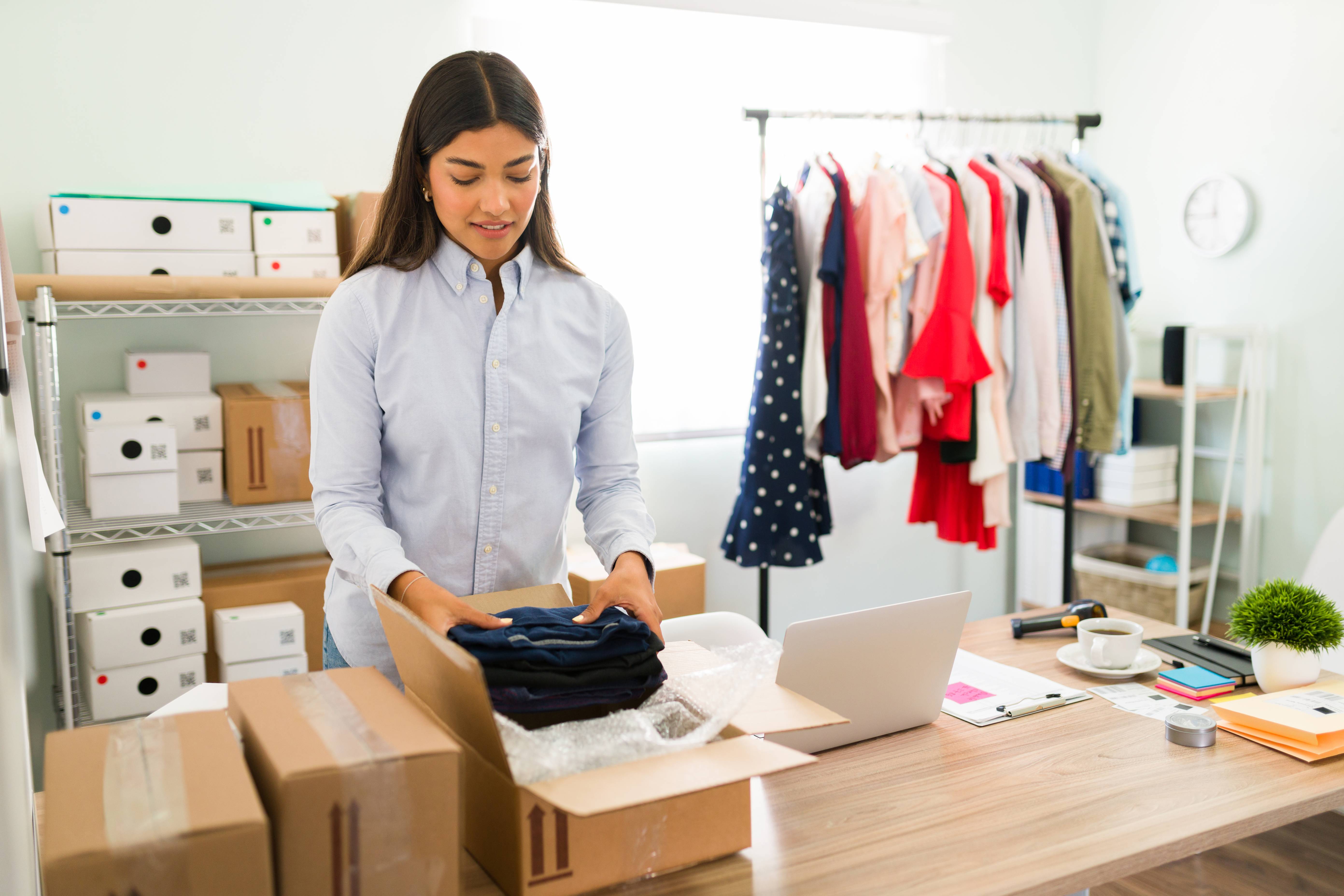 beautiful-business-owner-with-lot-online-orders-female-entrepreneur-preparing-clothes-put-packages (1)